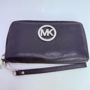 Michael Kors zip around black pebbled leather wristlet or phone case.